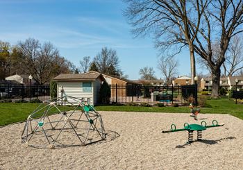 a playground at the whispering winds apartments in pearland, tx at Forest Glen, Michigan